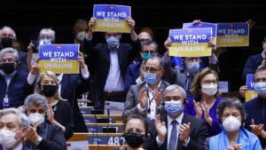 Members of European Parliament applaud after Ukrainian President Volodymyr Zelenskiy's speech at a special session to debate its response to the Russian invasion of Ukraine, in Brussels, Belgium March 1, 2022. REUTERS/Yves Herman
